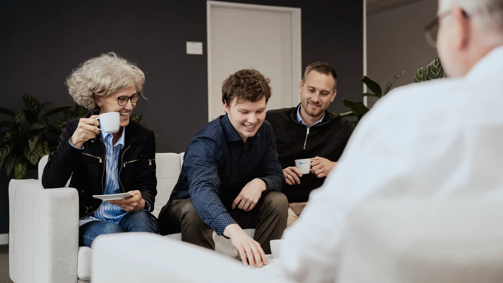Colleagues with coffee in the lounge area