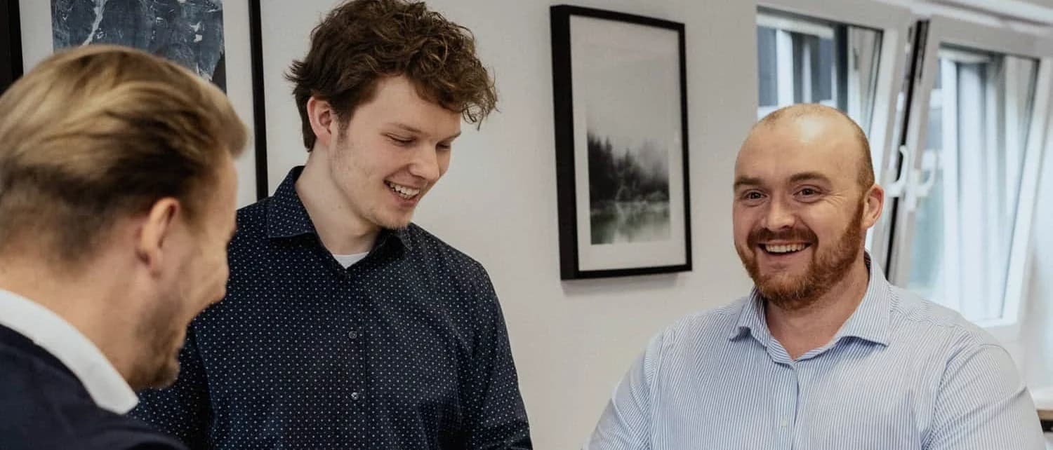 The TTL Network team in conversation at work